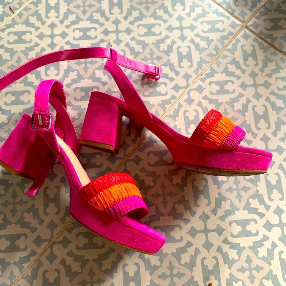 Pink mule heeled sandals.